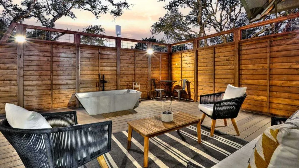 Safari tent deck at twilight at Spoon Mountain Glamping, adults-only glamping in Texas