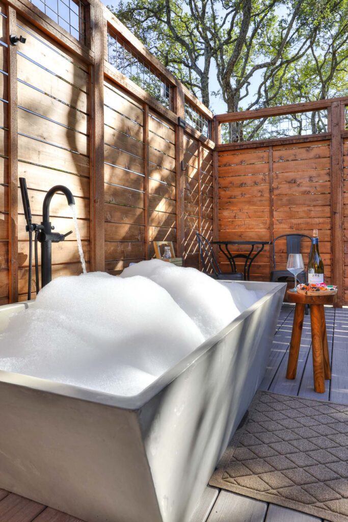 Private outdoor soaking tub at Spoon Mountain Glamping, Wimberley TX