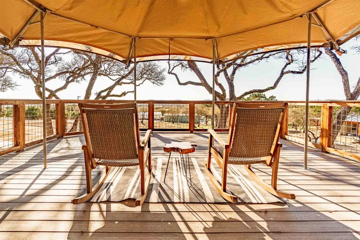 Safari tent deck with Hill Country views at Spoon Mountain Glamping near San Antonio