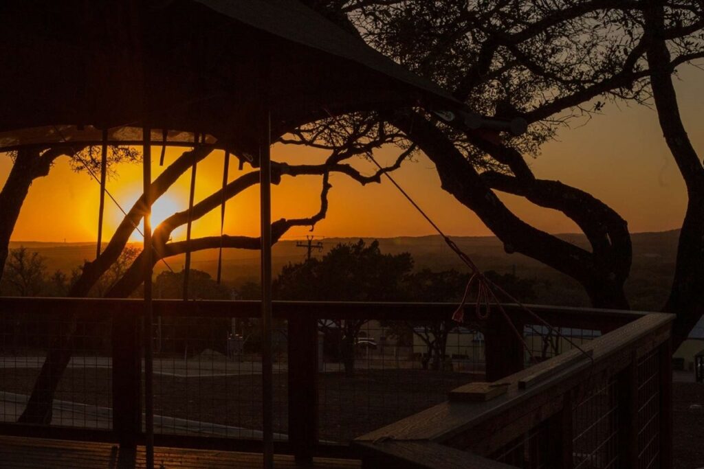 Hill Country sunset seen from a safari tent deck at Spoon Mountain Glamping, Wimberley, Texas