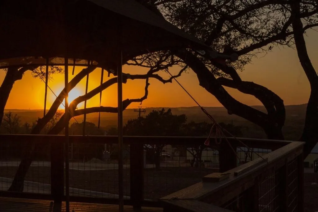 Hill Country sunset seen from a safari tent deck at Spoon Mountain Glamping, Wimberley, Texas