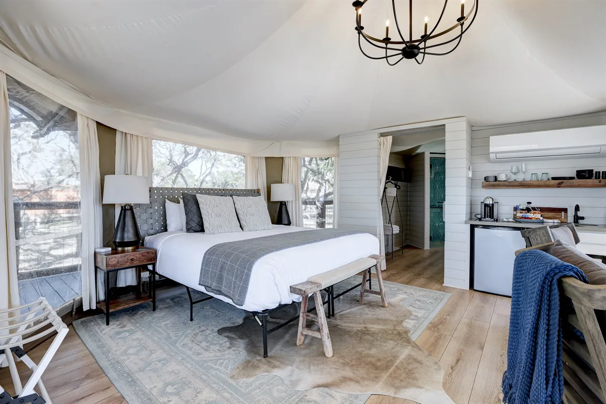 It's Time To Getaway and Go Glamping Near Austin 4 Interior of the Kingfisher safari tent with a king bed and kitchenette, Wimberley TX