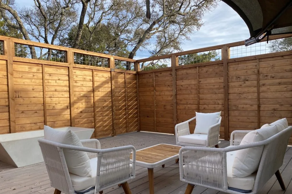 Private deck of the Shaka safari tent at Spoon Mountain Glamping, Wimberley TX